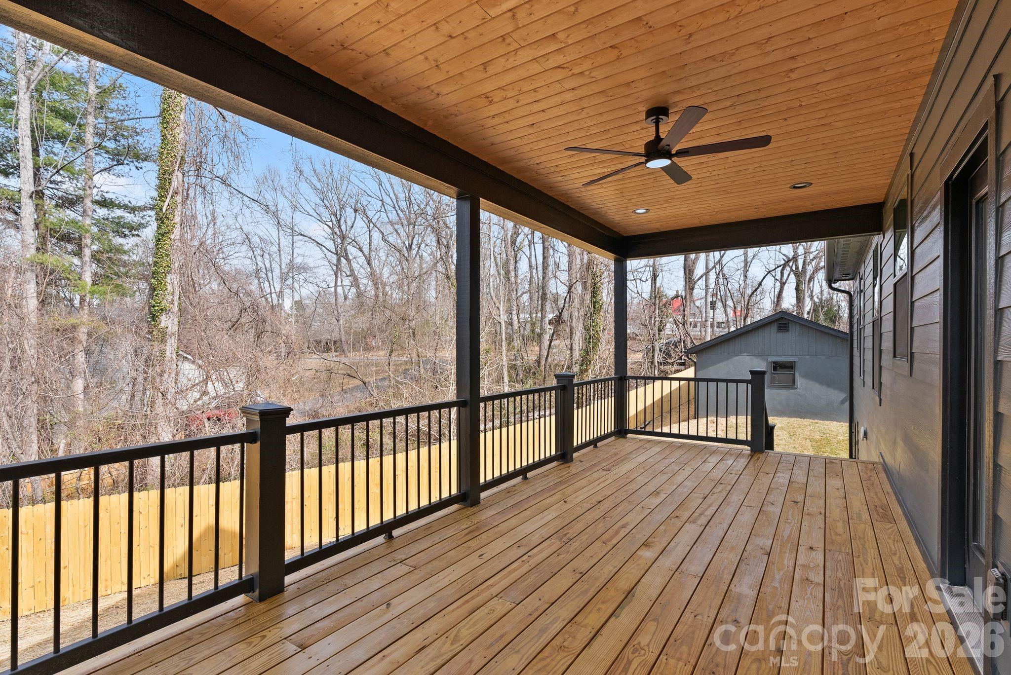 19 East Starnes Cove Road Asheville, NC 28806 - Photo 37 of 46 a view of a porch with wooden floor and outdoor space
