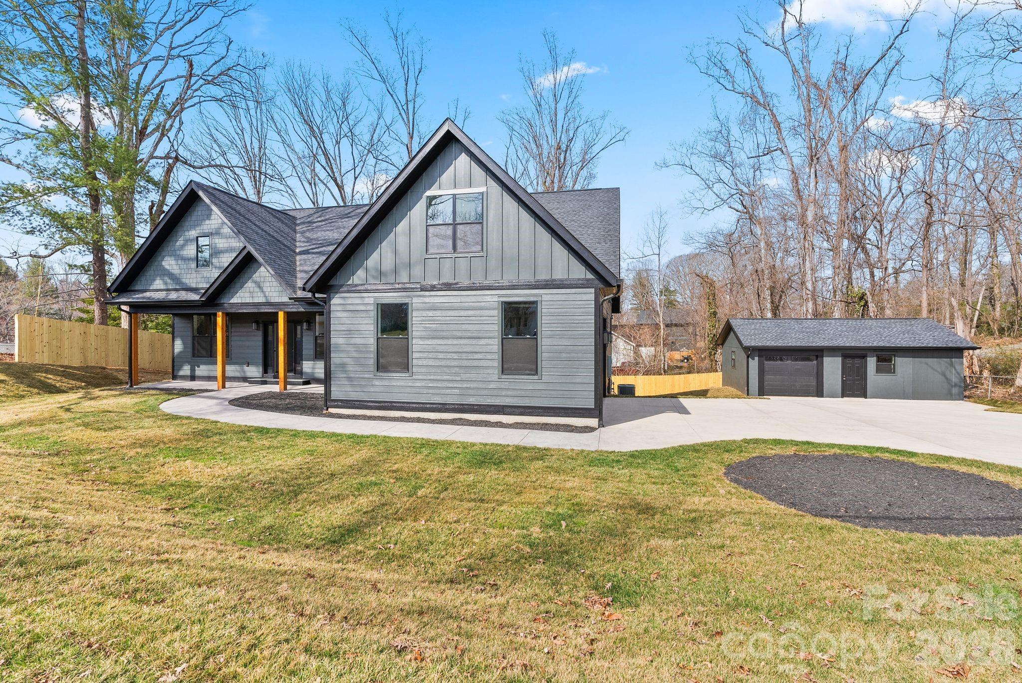 19 East Starnes Cove Road Asheville, NC 28806 - Photo 40 of 46 a view of a house with swimming pool and porch