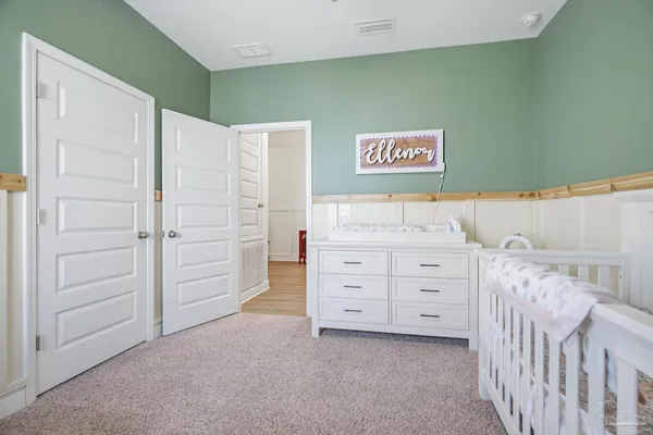 a bedroom with a bed and a cabinets