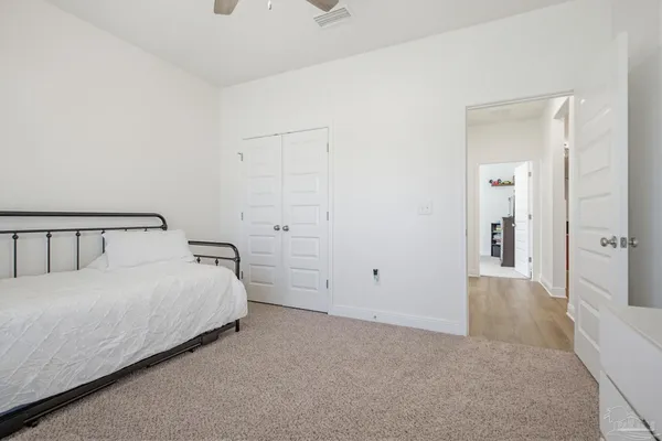 a bedroom with a bed and closet