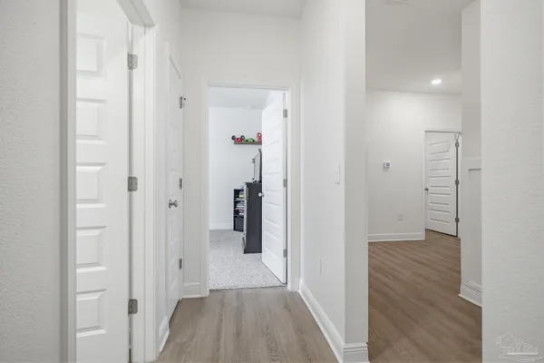 a view of a bathroom from the hallway