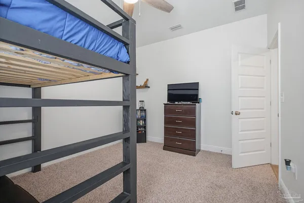 a view of an empty room with furniture and cabinet