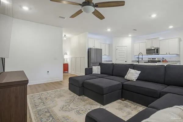 a living room with furniture and a rug