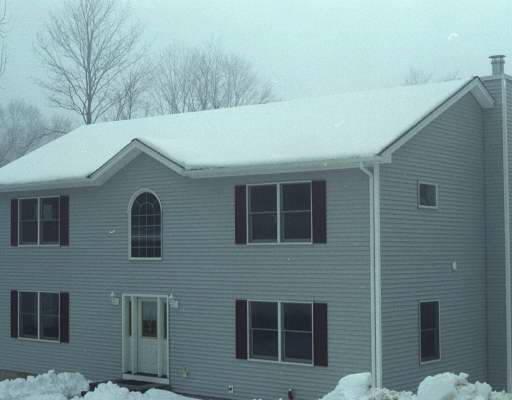 128 Carmen Hill Road, Unit 2 New Milford, CT 06776 - Photo 1 of 1 a view of house that has more windows and brick walls