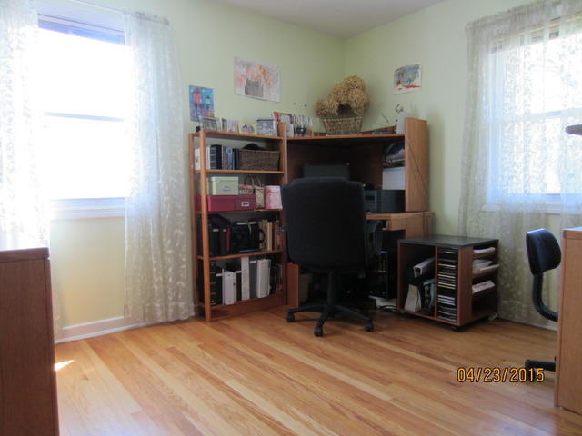 2249 Downey Road Homewood, IL 60430 - Photo 2 of 6 a room with furniture and a window