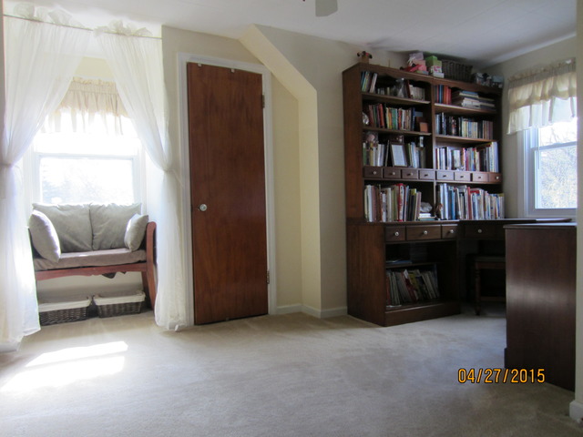 2249 Downey Road Homewood, IL 60430 - Photo 4 of 6 a living room with furniture and a book shelf