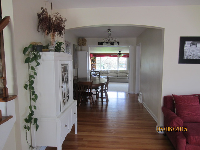 2249 Downey Road Homewood, IL 60430 - Photo 5 of 6 a living room with furniture and a chandelier