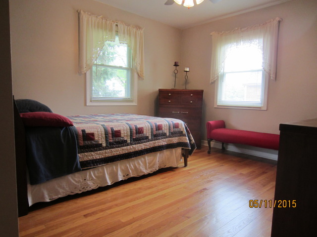 2249 Downey Road Homewood, IL 60430 - Photo 6 of 6 a spacious bedroom with a bed and a window