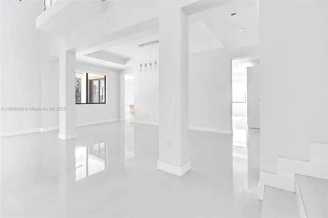 a view of a hallway with white walls