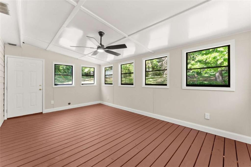 217 Quail Trail Cornelia, GA 30531 - Photo 15 of 48 a view of an empty room with wooden floor and a window