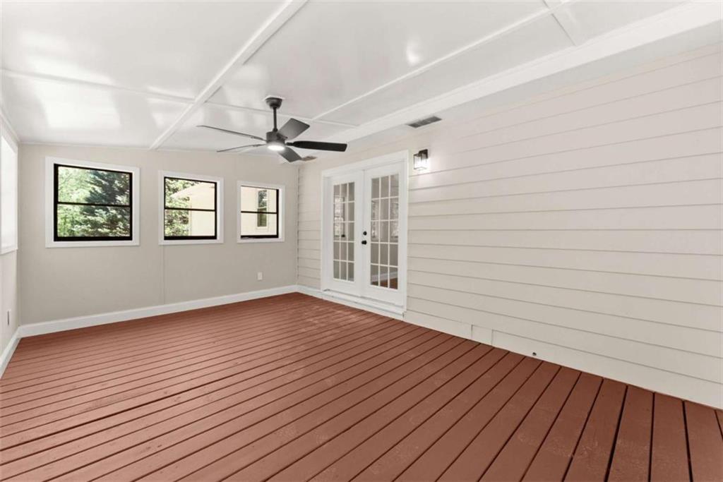 217 Quail Trail Cornelia, GA 30531 - Photo 16 of 48 a view of an empty room with wooden floor and a window