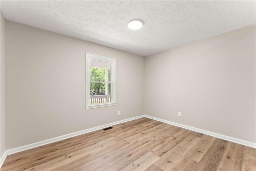 217 Quail Trail Cornelia, GA 30531 - Photo 25 of 48 wooden floor in an empty room with a window