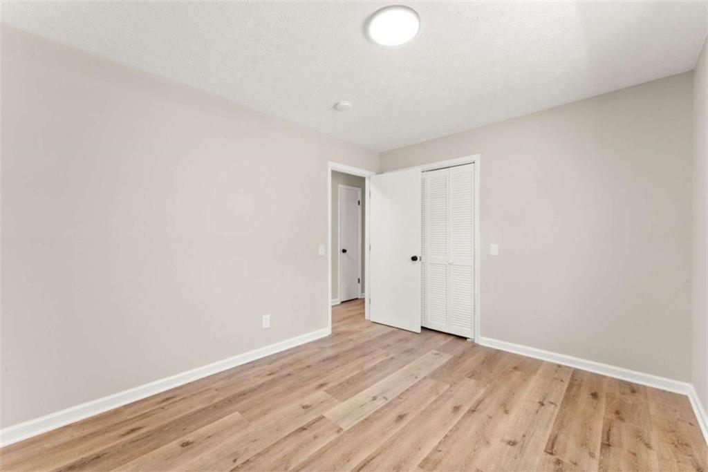 217 Quail Trail Cornelia, GA 30531 - Photo 26 of 48 a view of an empty room with wooden floor