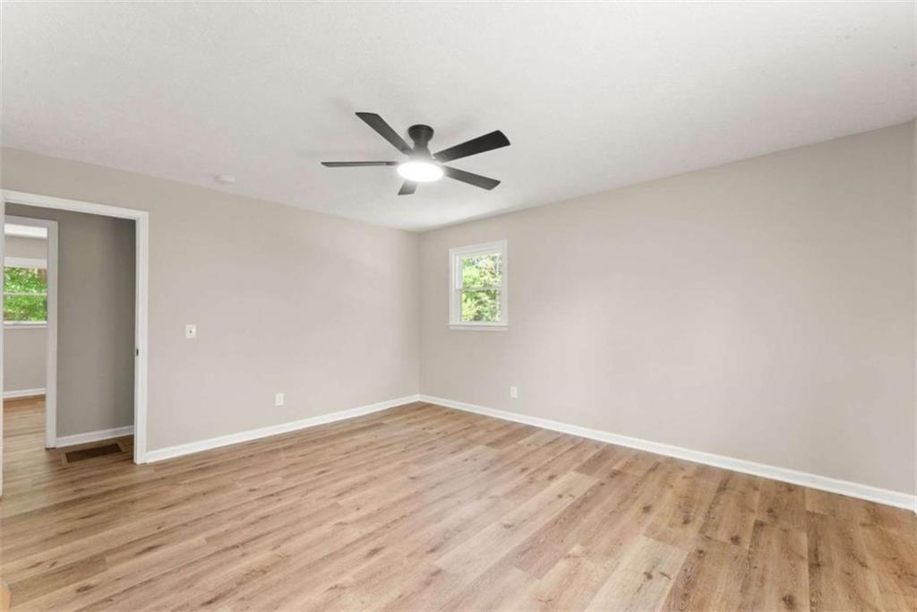 217 Quail Trail Cornelia, GA 30531 - Photo 28 of 48 an empty room with wooden floor and windows