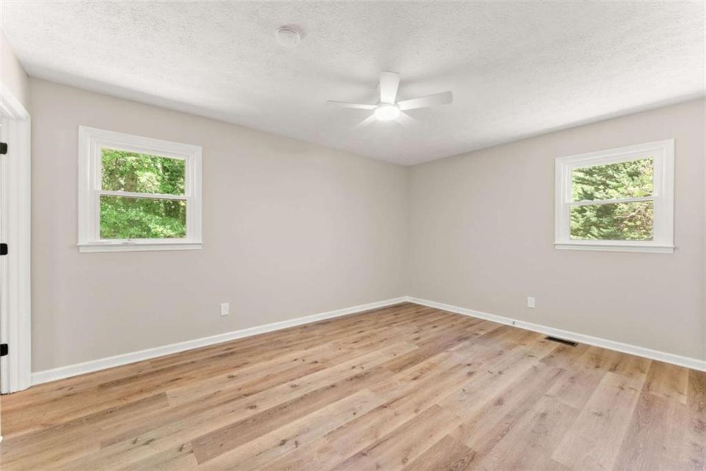 217 Quail Trail Cornelia, GA 30531 - Photo 32 of 48 wooden floor in an empty room with a window