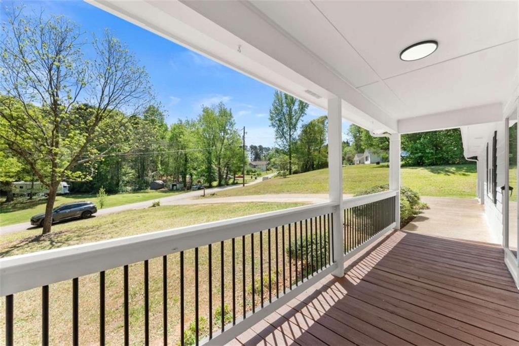 217 Quail Trail Cornelia, GA 30531 - Photo 8 of 48 a view of a balcony with wooden floor