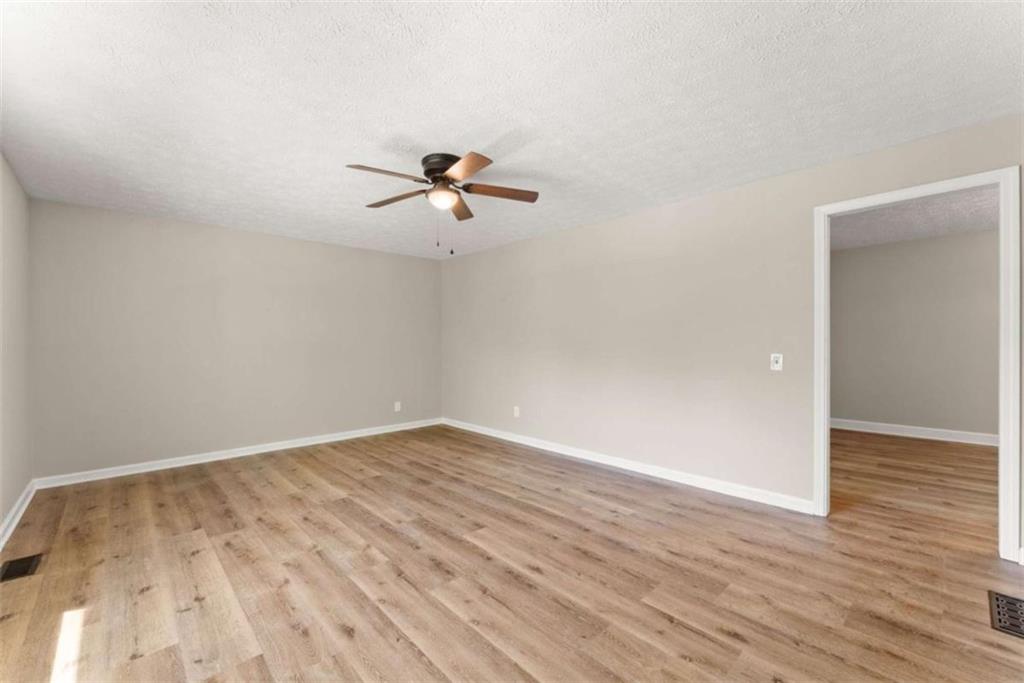 217 Quail Trail Cornelia, GA 30531 - Photo 10 of 48 wooden floor in an empty room with a window