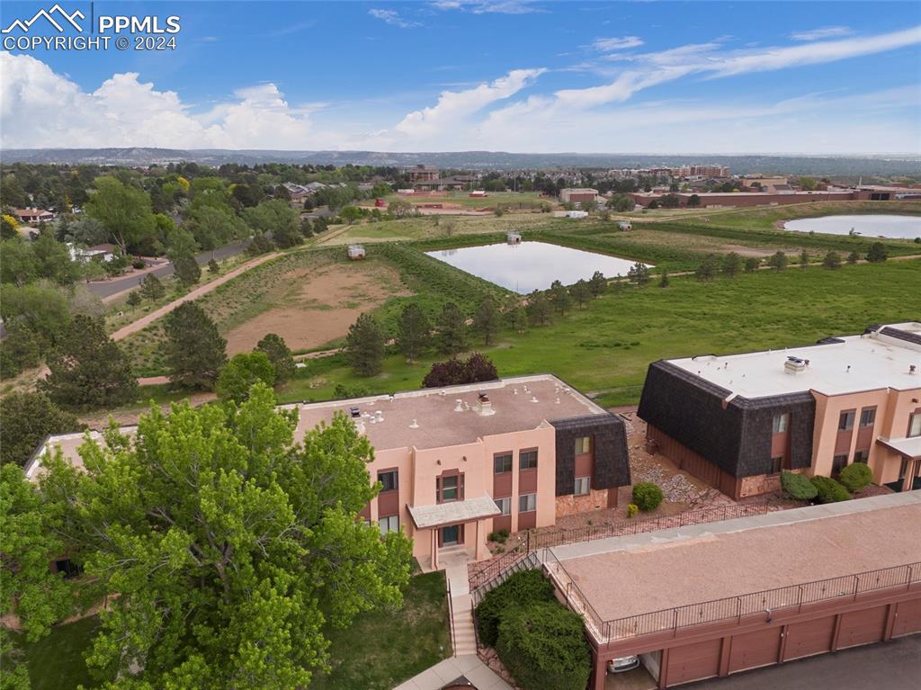 2949 Mesa Road, Unit C Colorado Springs, CO 80904 - Photo 24 of 28 an aerial view of a house with a garden and lake view