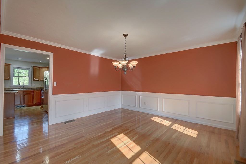 67 Arnold Road Sturbridge, MA 01518 - Photo 15 of 29 wooden floor in an empty room with a window
