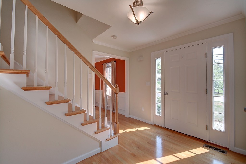 67 Arnold Road Sturbridge, MA 01518 - Photo 16 of 29 a view of an entryway with wooden floor and staircase