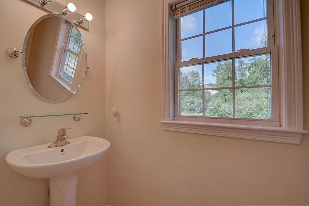 67 Arnold Road Sturbridge, MA 01518 - Photo 17 of 29 a bathroom with a sink and a mirror