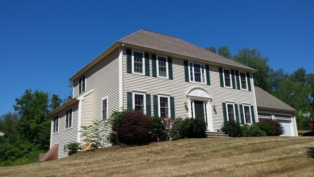 67 Arnold Road Sturbridge, MA 01518 - Photo 2 of 29 a front view of a house with a garden