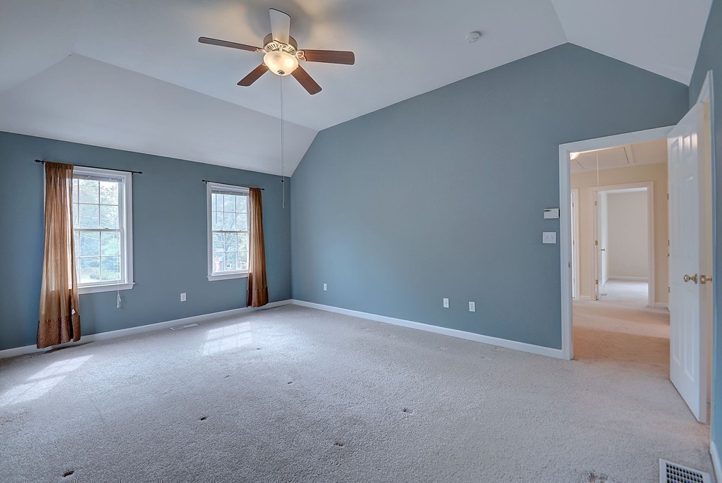 67 Arnold Road Sturbridge, MA 01518 - Photo 24 of 29 a view of a big room with windows and chandelier fan