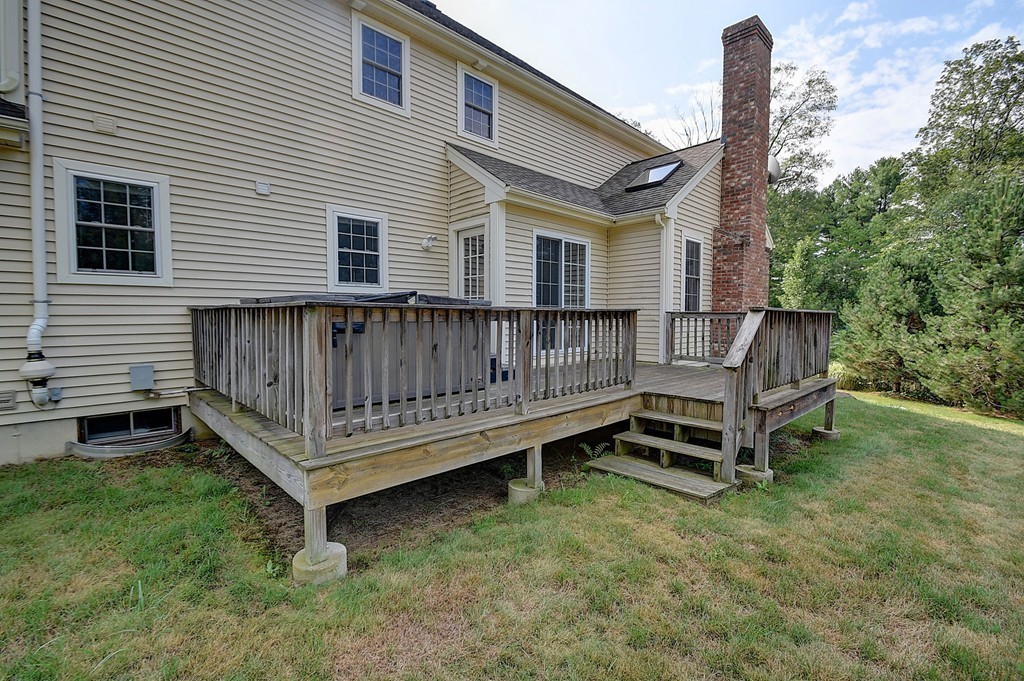 67 Arnold Road Sturbridge, MA 01518 - Photo 28 of 29 a view of a wooden bench sitting in the yard