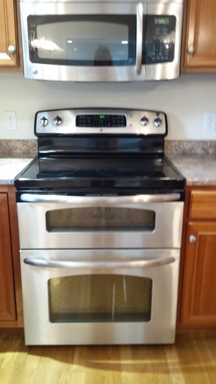 67 Arnold Road Sturbridge, MA 01518 - Photo 4 of 29 a stove top oven sitting inside of a kitchen