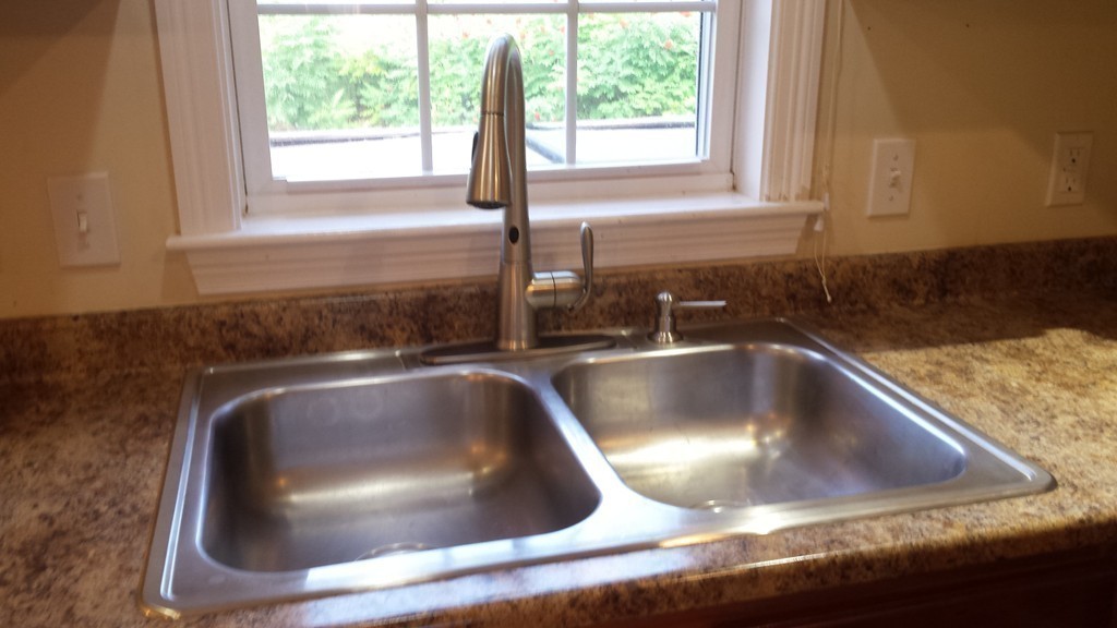 67 Arnold Road Sturbridge, MA 01518 - Photo 5 of 29 a kitchen with a sink and a window