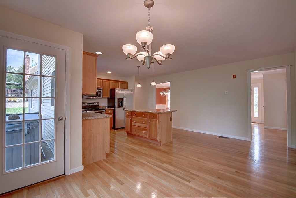 67 Arnold Road Sturbridge, MA 01518 - Photo 6 of 29 a view of a kitchen and dining room with wooden floor