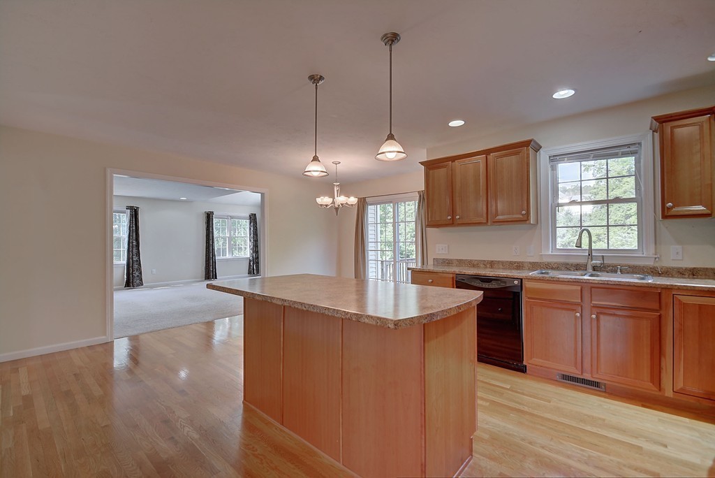 67 Arnold Road Sturbridge, MA 01518 - Photo 8 of 29 a kitchen with stainless steel appliances granite countertop a sink a stove and a wooden floors