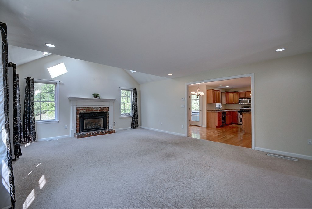 67 Arnold Road Sturbridge, MA 01518 - Photo 9 of 29 a view of an empty room with a fireplace