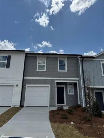 a front view of a house with a garage