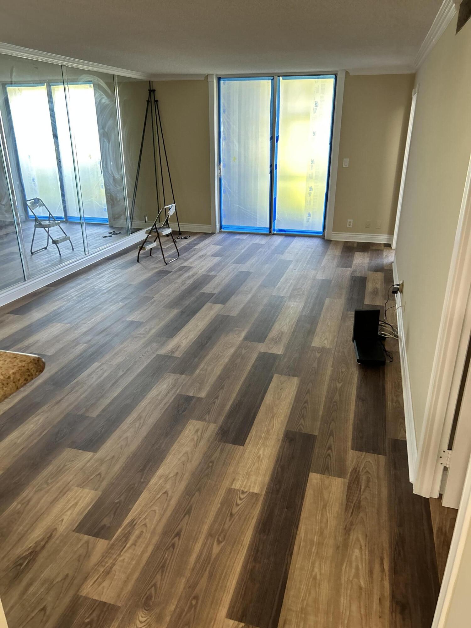 5201 Northwest 2nd Avenue, Unit 112 Boca Raton, FL 33487 - Photo 15 of 40 a view of a room with wooden floor and windows