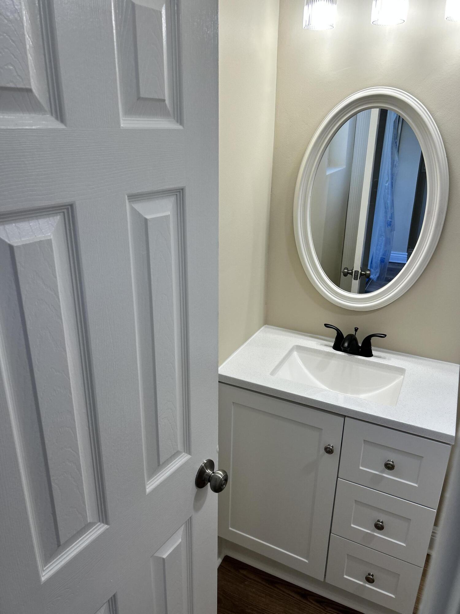 5201 Northwest 2nd Avenue, Unit 112 Boca Raton, FL 33487 - Photo 18 of 40 a bathroom with a sink and a mirror