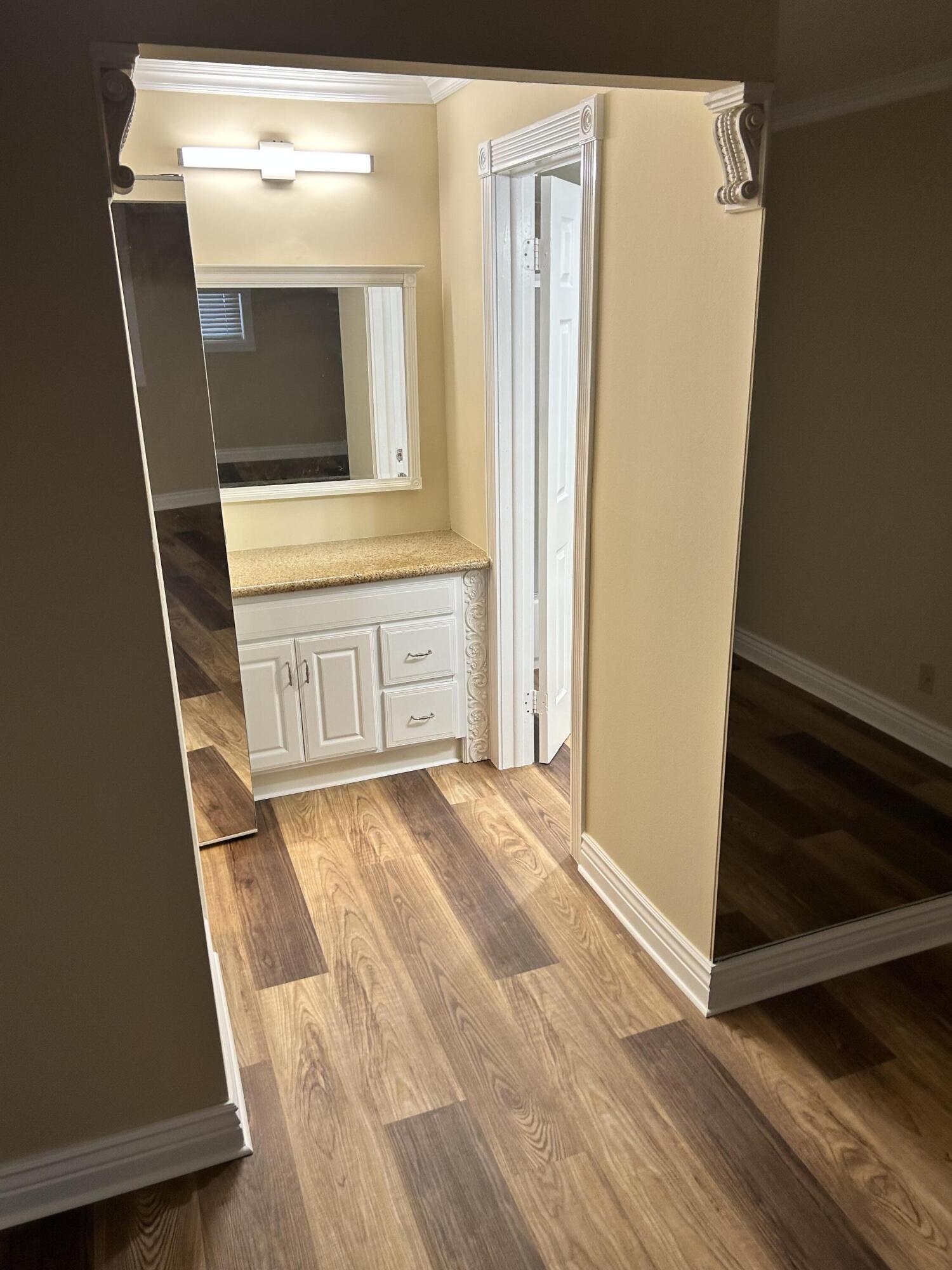 5201 Northwest 2nd Avenue, Unit 112 Boca Raton, FL 33487 - Photo 28 of 40 a view of front door with wooden floor