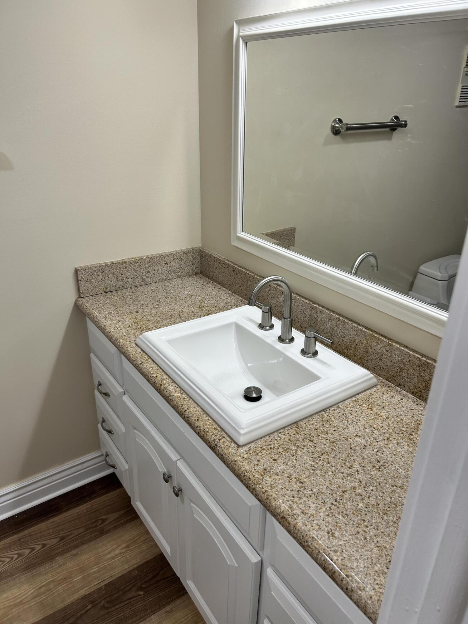 5201 Northwest 2nd Avenue, Unit 112 Boca Raton, FL 33487 - Photo 34 of 40 a bathroom with a sink and a mirror