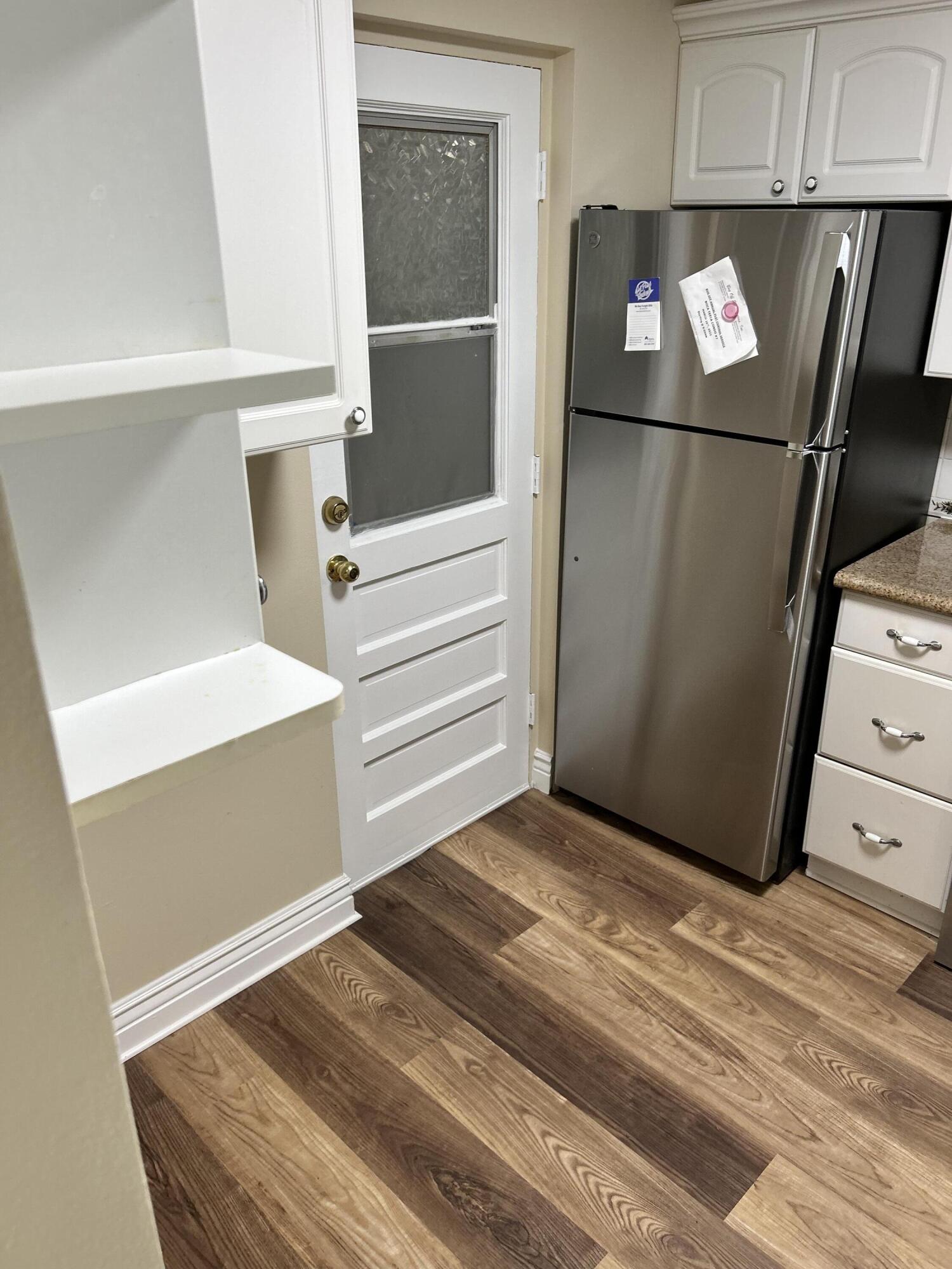 5201 Northwest 2nd Avenue, Unit 112 Boca Raton, FL 33487 - Photo 6 of 40 a view of a closet with wooden floor