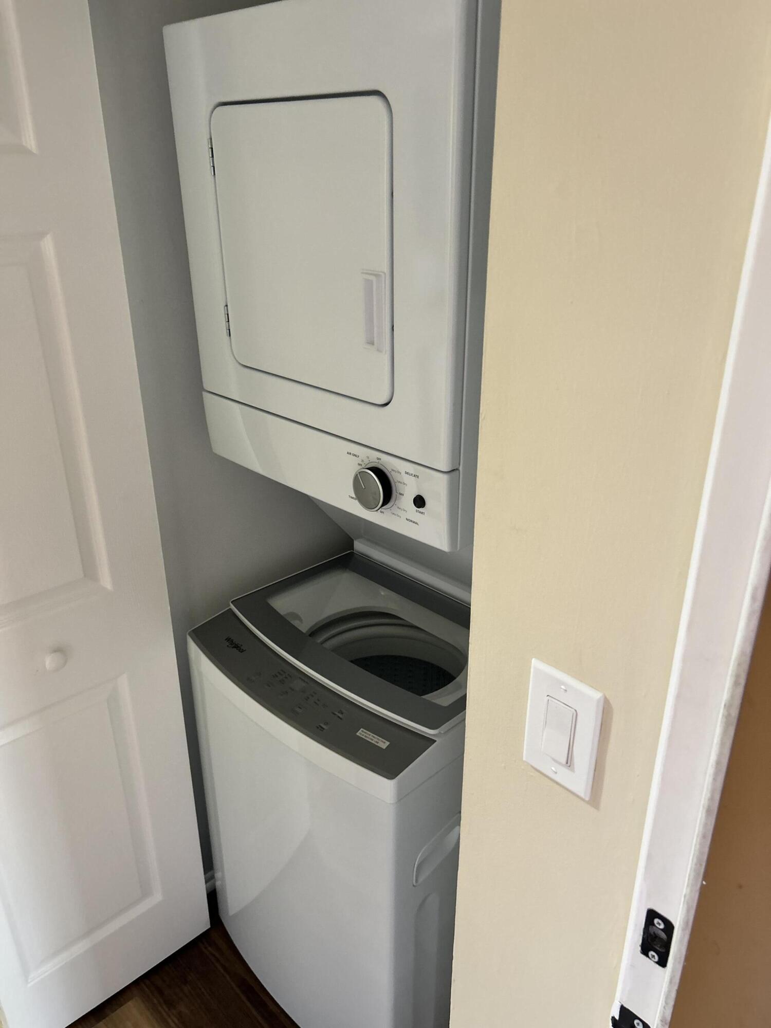 5201 Northwest 2nd Avenue, Unit 112 Boca Raton, FL 33487 - Photo 9 of 40 a close view of a utility room with dryer and washer