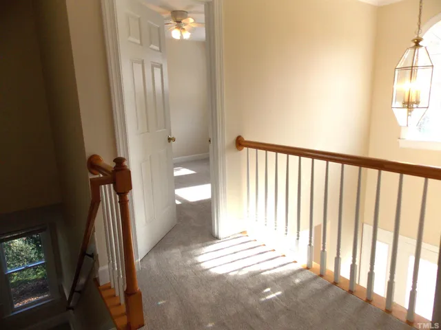 a view of a hallway with windows