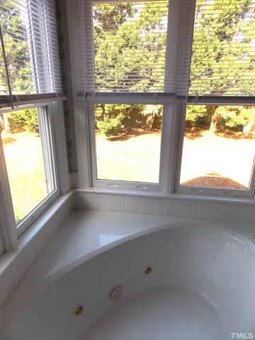 a view of an empty room and a window