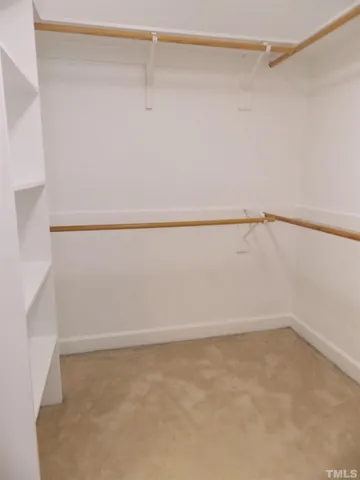 a view of an empty walk in closet