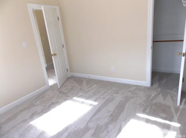 an empty room with a fireplace