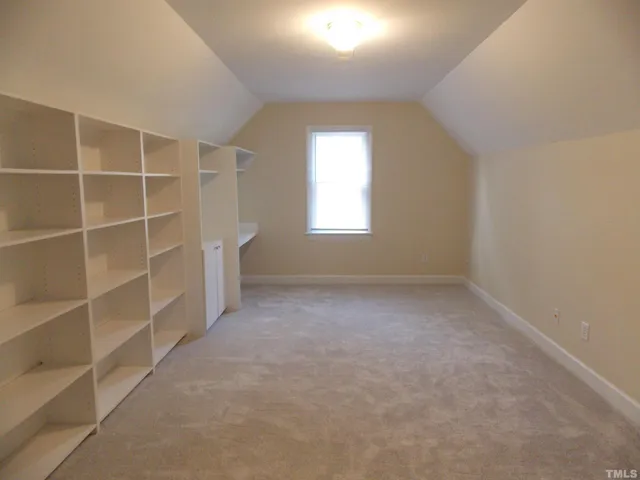 an empty room with a empty shelves