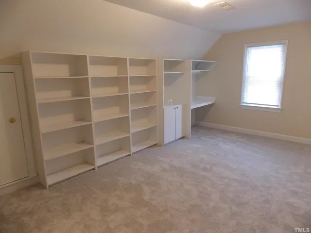 an empty room with a empty shelves