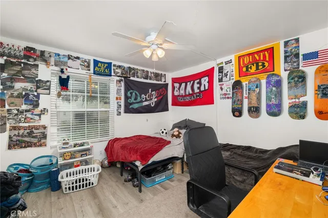 a bedroom with a workspace