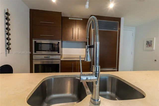 a kitchen with cabinets and appliances
