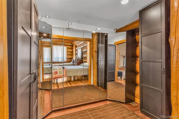 a bathroom with a glass door shower and a sink