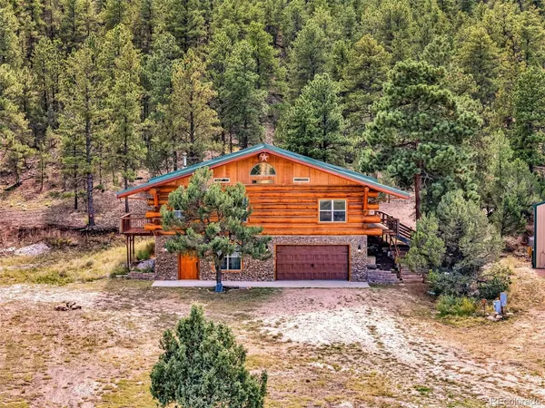 a backyard of a house with a yard and outdoor seating